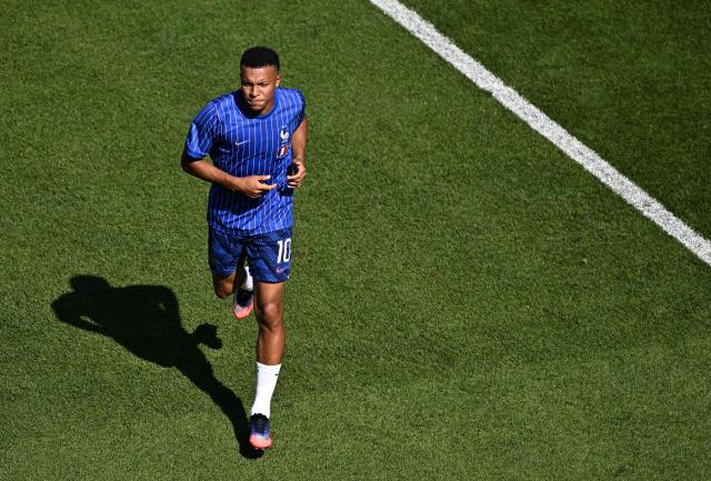 France's forward #10 Kylian Mbappe warms up ahead of the 2026 World Cup round of 16 football match between Paraguay and France at the Philadelphia Stadium in Philadelphia on July 4, 2026.  (Photo by Jewel SAMAD / AFP)