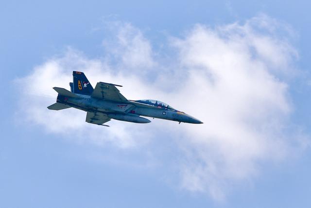 A US Navy F-18 fighter jet flies overhead during the "Salute to America" Independence Day celebration on the National Mall in Washington, DC, on July 4, 2026. The nation is marking the 250th anniversary of the United States Declaration of Indpendence. (Photo by Amid FARAHI / AFP)