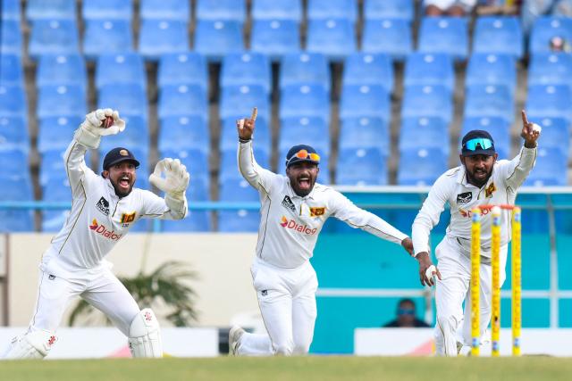 Kusal Mendis (L), Lahiru Udara (C) and Kamindu Mendis (R) of Sri Lanka unsuccessfully appeal for a caught-behind dismissal against John Campbell of West Indies (unseen) during the second day of the second Test cricket match between West Indies and Sri Lanka at Sir Vivian Richards Stadium in North Sound, Antigua and Barbuda, on July 4, 2026. (Photo by Randy Brooks / AFP)