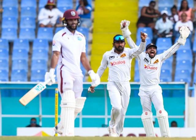 Kusal Mendis (R) and Kamindu Mendis (2R) of Sri Lanka unsuccessfully appeal for a caught-behind dismissal against John Campbell (L) of West Indies during the second day of the second Test cricket match between West Indies and Sri Lanka at Sir Vivian Richards Stadium in North Sound, Antigua and Barbuda, on July 4, 2026. (Photo by Randy Brooks / AFP)