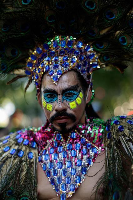 A participant attends the LGBTIQ (lesbian, gay, bisexual, transgender, intersex and queer) Pride parade in Madrid, on July 04, 2026. (Photo by OSCAR DEL POZO / AFP)