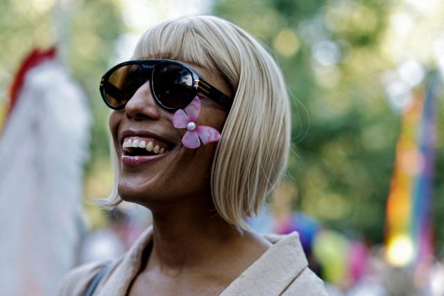 A participant attends the LGBTIQ (lesbian, gay, bisexual, transgender, intersex and queer) Pride parade in Madrid, on July 04, 2026. (Photo by OSCAR DEL POZO / AFP)