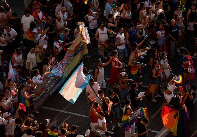 Aerial view of participants attending the LGBTIQ (lesbian, gay, bisexual, transgender, intersex and queer) Pride parade in Madrid, on July 04, 2026. (Photo by OSCAR DEL POZO / AFP)