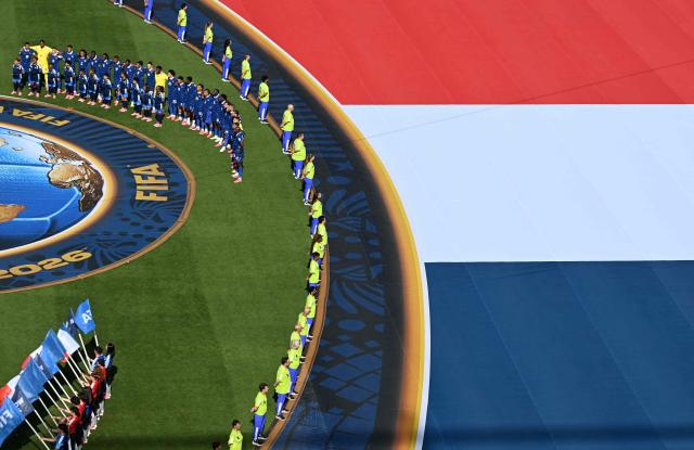 France's players stand for their national anthem ahead of the 2026 World Cup round of 16 football match between Paraguay and France at the Philadelphia Stadium in Philadelphia on July 4, 2026.  (Photo by Jewel SAMAD / AFP)
