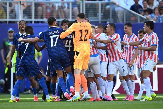 Paraguay and France players argue during the 2026 World Cup round of 16 football match between Paraguay and France at the Philadelphia Stadium in Philadelphia on July 4, 2026.  (Photo by MAURO PIMENTEL / AFP)