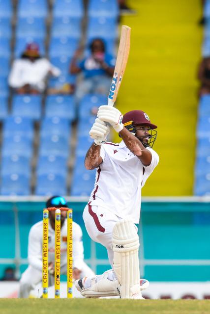 John Campbell of West Indies hits 4 during the second day of the second Test cricket match between West Indies and Sri Lanka at Sir Vivian Richards Stadium in North Sound, Antigua and Barbuda, on July 4, 2026. (Photo by Randy Brooks / AFP)