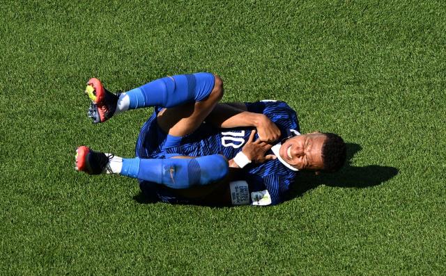 France's forward #10 Kylian Mbappe reacts in pain during the 2026 World Cup round of 16 football match between Paraguay and France at the Philadelphia Stadium in Philadelphia on July 4, 2026.  (Photo by Jewel SAMAD / AFP)