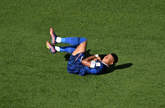 France's forward #10 Kylian Mbappe reacts in pain during the 2026 World Cup round of 16 football match between Paraguay and France at the Philadelphia Stadium in Philadelphia on July 4, 2026.  (Photo by Jewel SAMAD / AFP)
