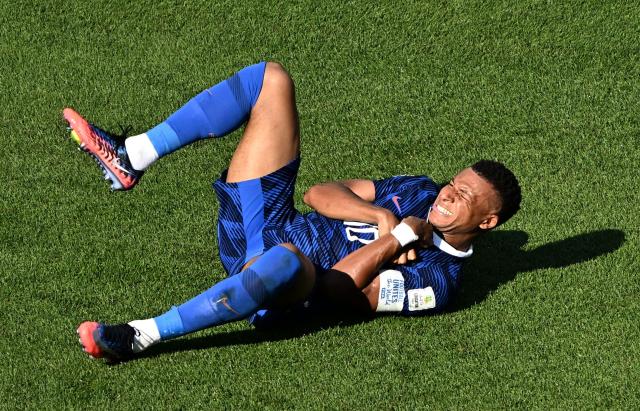 France's forward #10 Kylian Mbappe reacts on the ground during the 2026 World Cup round of 16 football match between Paraguay and France at the Philadelphia Stadium in Philadelphia on July 4, 2026.  (Photo by Jewel SAMAD / AFP)