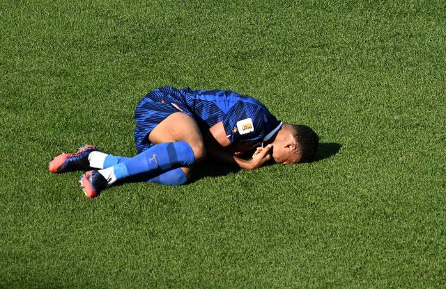 France's forward #10 Kylian Mbappe reacts in pain during the 2026 World Cup round of 16 football match between Paraguay and France at the Philadelphia Stadium in Philadelphia on July 4, 2026.  (Photo by Jewel SAMAD / AFP)
