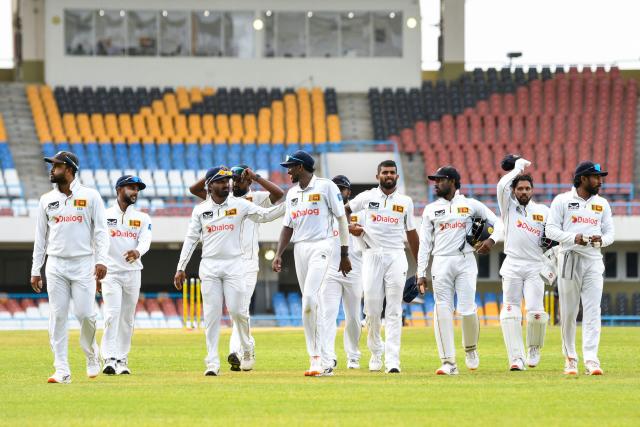 Sri Lanka players walk off the field at the end of the second day of the second Test cricket match between West Indies and Sri Lanka at Sir Vivian Richards Stadium in North Sound, Antigua and Barbuda, on July 4, 2026. (Photo by Randy Brooks / AFP)