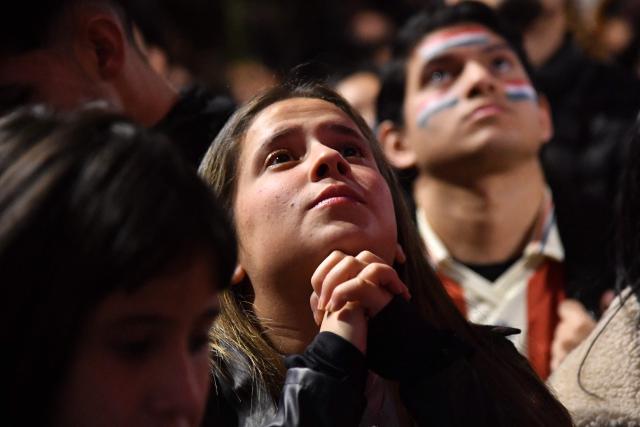 A Paraguay supporter reacts as she watches the FIFA World Cup 2026 round-of-32 football match between Paraguay and France in Asuncion on July 4, 2026. (Photo by DANIEL DUARTE / AFP)