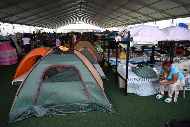 Displaced people take shelter at the Jose Maria Vargas sports complex domo in Maiquetia, La Guaira state, Venezuela, on July 3, 2026, following the June 24 twin earthquakes. The death toll from Venezuela's devastating twin earthquakes has risen to 2,954, according to official figures released on Saturday. (Photo by Raul ARBOLEDA / AFP)