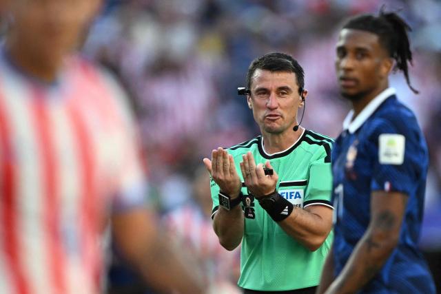 Uzbek referee Ilgiz Tantashev gestures during the 2026 World Cup round of 16 football match between Paraguay and France at the Philadelphia Stadium in Philadelphia on July 4, 2026.  (Photo by MAURO PIMENTEL / AFP)