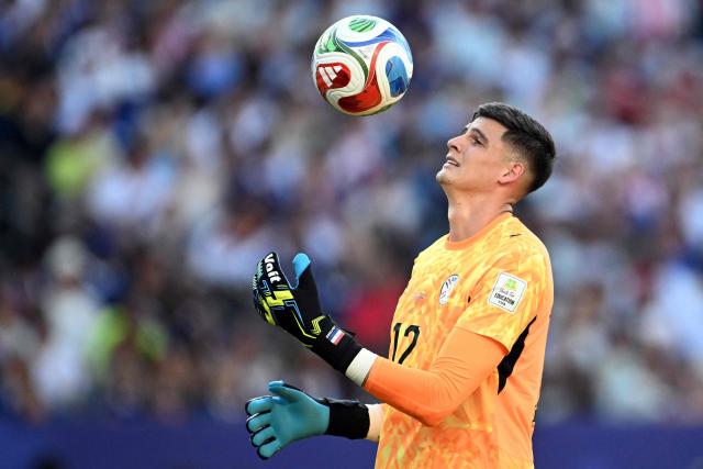 Paraguay's goalkeeper #12 Orlando Gill controls the ball during the 2026 World Cup round of 16 football match between Paraguay and France at the Philadelphia Stadium in Philadelphia on July 4, 2026.  (Photo by MAURO PIMENTEL / AFP)