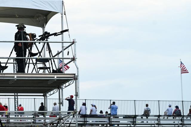 Members of the US Secret Service stand on a platform during the "Salute to America" Independence Day celebration on the National Mall in Washington, DC, on July 4, 2026. The nation is marking the 250th anniversary of the United States Declaration of Indpendence. (Photo by Alex WROBLEWSKI / AFP)