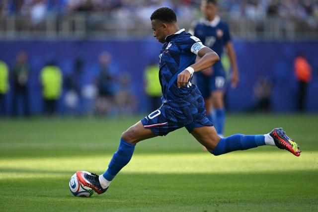 France's forward #10 Kylian Mbappe kicks the ball during the 2026 World Cup round of 16 football match between Paraguay and France at the Philadelphia Stadium in Philadelphia on July 4, 2026.  (Photo by MAURO PIMENTEL / AFP)