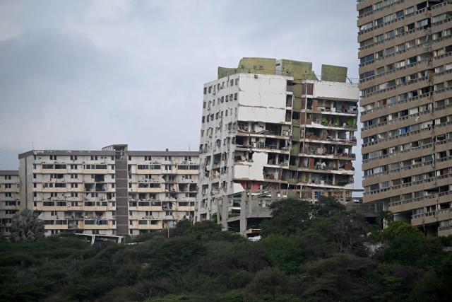 View of heavily damaged buildings in Catia La Mar, La Guaira state, on the outskirts of Caracas, on July 4, 2026, following the June 24 twin earthquakes. The death toll from Venezuela's devastating twin earthquakes has risen to 2,954, according to official figures released on Saturday. (Photo by Juan BARRETO / AFP)