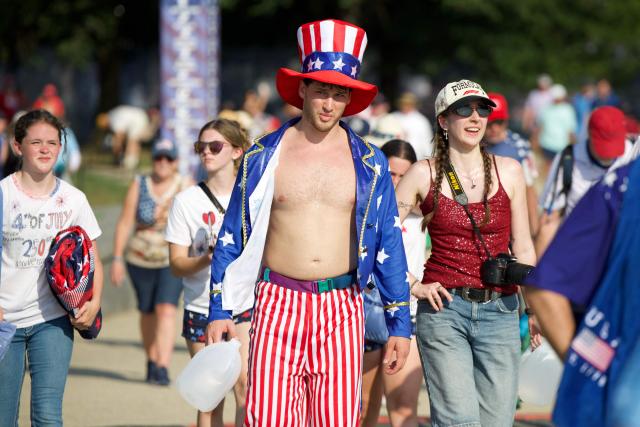 an A man wearing Americana-themed outfit attends the “Salute to America” Independence Day celebration on the National Mall in Washington, DC, on July 4, 2026. The nation is marking the 250th anniversary of the United States Declaration of Indpendence. (Photo by Amid FARAHI / AFP)