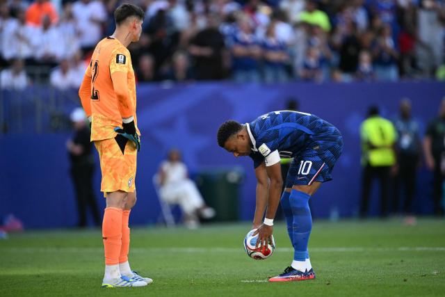 France's forward #10 Kylian Mbappe places the ball on the penalty spot past Paraguay's goalkeeper #12 Orlando Gill during the 2026 World Cup round of 16 football match between Paraguay and France at the Philadelphia Stadium in Philadelphia on July 4, 2026.  (Photo by MAURO PIMENTEL / AFP)