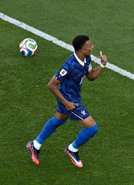 France's forward #10 Kylian Mbappe celebrates scoring his team's first goal from the penalty spot during the 2026 World Cup round of 16 football match between Paraguay and France at the Philadelphia Stadium in Philadelphia on July 4, 2026.  (Photo by Jewel SAMAD / AFP)