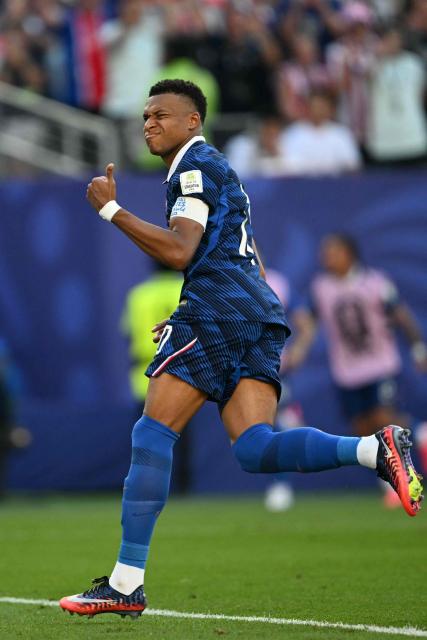 France's forward #10 Kylian Mbappe celebrates scoring his team's first goal during the 2026 World Cup round of 16 football match between Paraguay and France at the Philadelphia Stadium in Philadelphia on July 4, 2026.  (Photo by MAURO PIMENTEL / AFP)