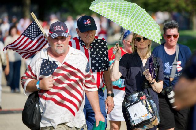 People arrive to attend the "Salute to America" Independence Day celebration on the National Mall in Washington, DC, on July 4, 2026. The nation is marking the 250th anniversary of the United States Declaration of Indpendence. (Photo by Amid FARAHI / AFP)