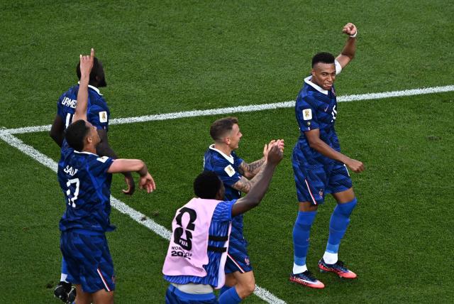 France's forward #10 Kylian Mbappe and teammates celebrate after winning the 2026 World Cup round of 16 football match between Paraguay and France at the Philadelphia Stadium in Philadelphia on July 4, 2026.  (Photo by Jewel SAMAD / AFP)