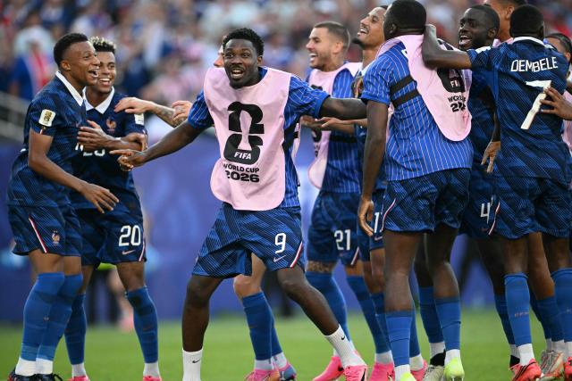 France's forward #10 Kylian Mbappe celebrates with teammates after winning the 2026 World Cup round of 16 football match between Paraguay and France at the Philadelphia Stadium in Philadelphia on July 4, 2026.  (Photo by MAURO PIMENTEL / AFP)