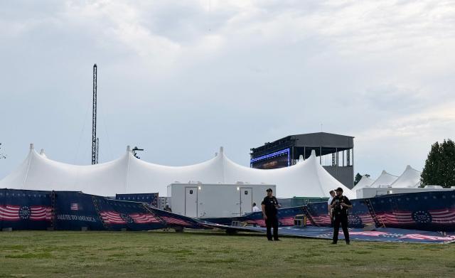 US Park Police officers stand by fencing knocked down by the wind as people are evacuated due to thunderstorms in the area at the Great American State Fair during the "Salute to America" Independence Day celebration on the National Mall in Washington, DC, on July 4, 2026. The nation is marking the 250th anniversary of the United States Declaration of Indpendence. (Photo by Paul BLAKE / AFP)