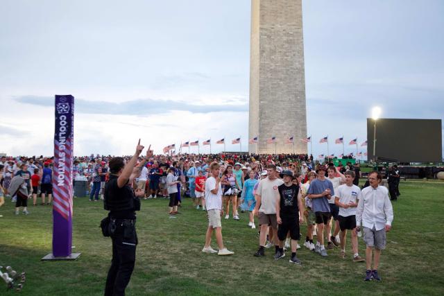 Attendees are directed to evacuate due to thunderstorms in the area during the "Salute to America" Independence Day celebration on the National Mall in Washington, DC, on July 4, 2026. The nation is marking the 250th anniversary of the United States Declaration of Indpendence. (Photo by Amid FARAHI / AFP)