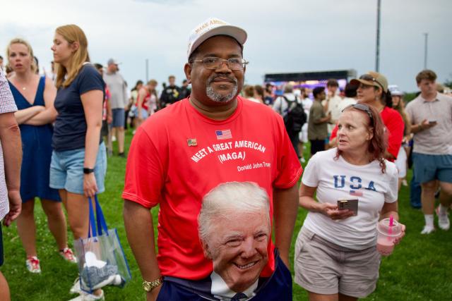 People gather near the Washington Monument after being evacuated from the event site of the "Salute to America" Independence Day celebration due to thunderstorms in the area in Washington, DC, on July 4, 2026. The nation is marking the 250th anniversary of the United States Declaration of Indpendence. (Photo by Amid FARAHI / AFP)