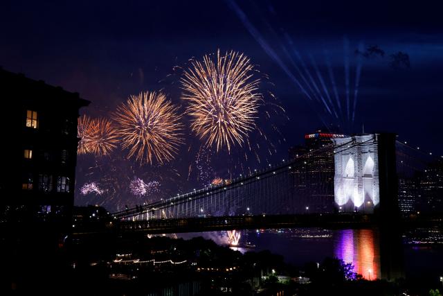Fireworks light up the Brooklyn Bridge during the Macy's Fourth of July Fireworks celebration in New York City, on July 4, 2026. (Photo by Leonardo MUNOZ / AFP)