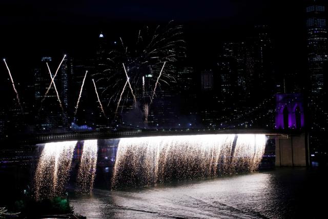 Fireworks light up the Brooklyn Bridge during the Macy's Fourth of July Fireworks celebration in New York City, on July 4, 2026. (Photo by Leonardo MUNOZ / AFP)