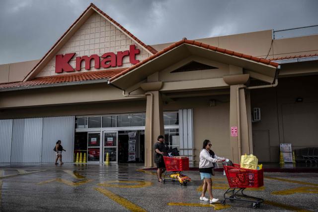 People shop for supplies at a supermarket as the forecasted Super Typhoon Bavi approaches in Guam, Northern Mariana Islands, on July 5, 2026. (Photo by Yuichi YAMAZAKI / AFP)