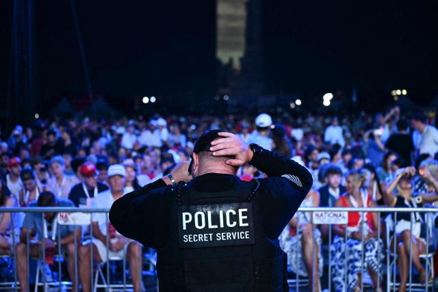 A member of the US Secret Service stands as audience members wait for US President Donald Trump to speak during the "Salute to America" Independence Day celebration on the National Mall in Washington, DC, on July 4, 2026. The nation is marking the 250th anniversary of the United States Declaration of Indpendence. (Photo by Kent NISHIMURA / AFP)