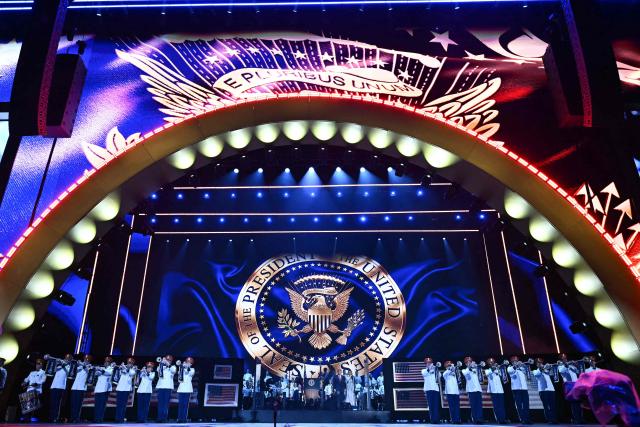 US President Donald Trump and US First Lady Melania Trump arrive onstage during the "Salute to America" Independence Day celebration on the National Mall in Washington, DC, on July 4, 2026. The nation is marking the 250th anniversary of the United States Declaration of Indpendence. (Photo by Kent NISHIMURA / AFP)