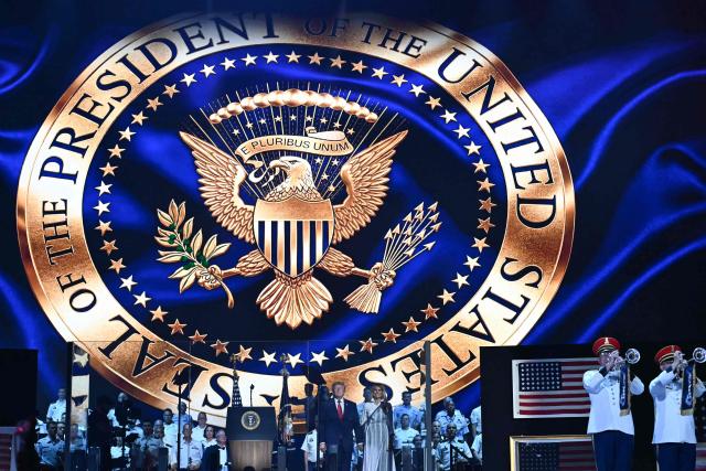 US President Donald Trump and US First Lady Melania Trump arrive onstage during the "Salute to America" Independence Day celebration on the National Mall in Washington, DC, on July 4, 2026. The nation is marking the 250th anniversary of the United States Declaration of Indpendence. (Photo by Kent NISHIMURA / AFP)