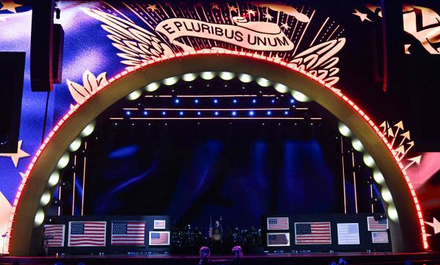 Revolutionary-era “First American” flags are displayed on stage as U.S. President Donald Trump speaks during the “Salute to America” Independence Day celebration on the National Mall in Washington, DC, on July 4, 2026. The nation is marking the 250th anniversary of the United States Declaration of Indpendence. (Photo by Alex WROBLEWSKI / AFP)