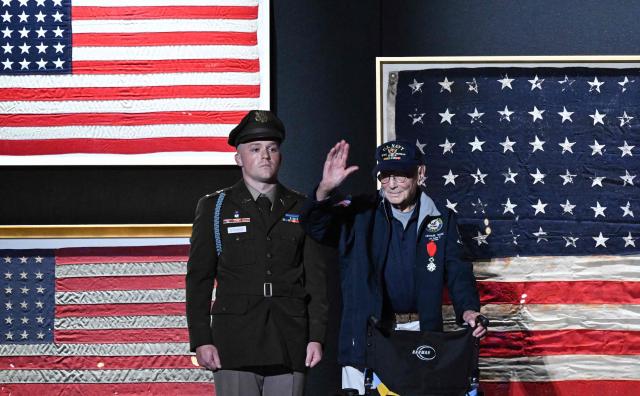 107-year-old WWII veteran Harry F. Rose (R) waves as US President Donald Trump (unseen) speaks during the “Salute to America” Independence Day celebration on the National Mall in Washington, DC, on July 4, 2026.. The nation is marking the 250th anniversary of the United States Declaration of Indpendence. (Photo by Alex WROBLEWSKI / AFP)