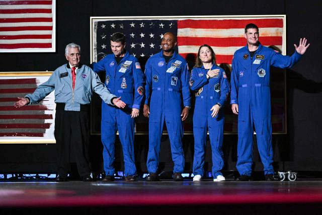 (L/R) Retired astronaut Harrison Schmitt, Artemis II crew members Reid Wiseman, Victor Glover, Christina Koch and Jeremy Hansen stand onstage as US President Donald Trump speaks during the "Salute to America" Independence Day celebration on the National Mall in Washington, DC, on July 4, 2026. The nation is marking the 250th anniversary of the United States Declaration of Indpendence. (Photo by Kent NISHIMURA / AFP)