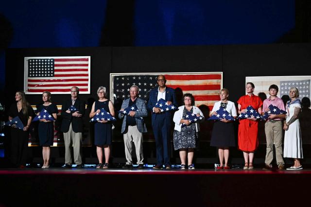 Gold star family members, relatives of US military members who died in battle, stand onstage as US President Donald Trump speaks during the "Salute to America" Independence Day celebration on the National Mall in Washington, DC, on July 4, 2026. The nation is marking the 250th anniversary of the United States Declaration of Indpendence. (Photo by Kent NISHIMURA / AFP)