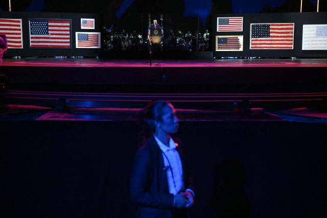 A member of the Secret Service stands in front of the stage as US President Donald Trump speaks during the "Salute to America" Independence Day celebration on the National Mall in Washington, DC, on July 4, 2026. The nation is marking the 250th anniversary of the United States Declaration of Indpendence. (Photo by Kent NISHIMURA / AFP)