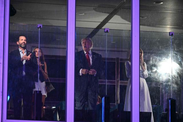Donald Trump Jr. (L), Kai Trump, US President Donald Trump and US First Lady Melania Trump watch the fireworks display during the "Salute to America" Independence Day celebration on the National Mall in Washington, DC, in the early morning hours of July 5, 2026. The nation is marking the 250th anniversary of the United States Declaration of Indpendence. (Photo by Kent NISHIMURA / AFP)