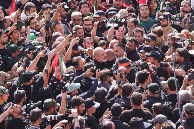 Chief of Iran's Revolutionary Guards, Ahmad Vahidi (C) arrives to gather with mourners at the Grand Mosalla to pay their final respects to Iran's slain supreme leader Ayatollah Ali Khamenei during the second day of funeral ceremonies in Tehran on July 5, 2026. Prayers were held July 5 over the casket of Iran's late supreme leader Ali Khamenei, the second day of funeral ceremonies that have drawn huge crowds to pay their final respects in Tehran. Khamenei ruled the Islamic republic from 1989 until he was killed aged 86 in an airstrike on the first day of the US-Israeli war with Iran on February 28. (Photo by ATTA KENARE / AFP) / 