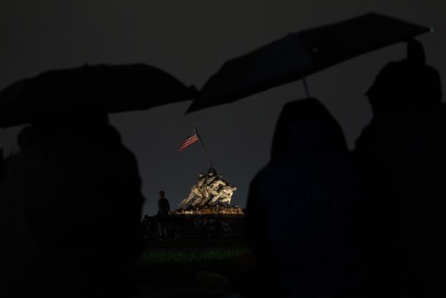 People wait for the start of the fireworks during the "Salute to America" Independence Day celebration on the National Mall in Washington, DC, on July 4, 2026. The nation is marking the 250th anniversary of the United States Declaration of Indpendence. (Photo by Ken Cedeno / AFP)