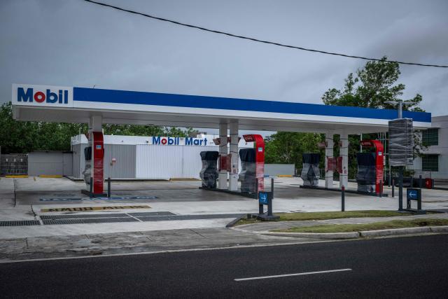 A closed gas station is seen as the forecasted Super Typhoon Bavi approaches in Guam, Northern Mariana Islands, on July 5, 2026. People in Guam and the Northern Marianas moved to emergency evacuation centers and made last-minute preparations on July 5, hours before a "super typhoon" was projected to bulldoze through the US Pacific territories. (Photo by Yuichi YAMAZAKI / AFP)