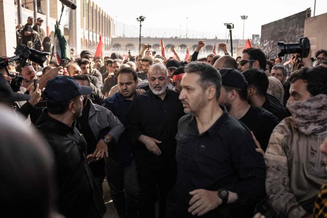 Chief of Iran's Revolutionary Guards, Ahmad Vahidi (C) arrives to pray for Iran's slain supreme leader Ayatollah Ali Khamenei with mourners during the second day of funeral ceremonies at the Grand Mosalla in Tehran on July 5, 2026. Prayers were held July 5 over the casket of Iran's late supreme leader Ali Khamenei, the second day of funeral ceremonies that have drawn huge crowds to pay their final respects in Tehran. Khamenei ruled the Islamic republic from 1989 until he was killed aged 86 in an airstrike on the first day of the US-Israeli war with Iran on February 28. (Photo by AFP) / 
