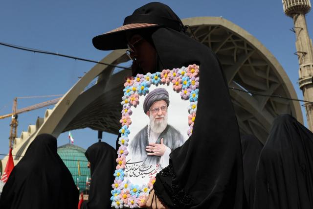 Mourners gather to pray for Iran's slain supreme leader Ayatollah Ali Khamenei during the second day of funeral ceremonies at the Grand Mosalla in Tehran on July 5, 2026. Prayers were held July 5 over the casket of Iran's late supreme leader Ali Khamenei, the second day of funeral ceremonies that have drawn huge crowds to pay their final respects in Tehran. Khamenei ruled the Islamic republic from 1989 until he was killed aged 86 in an airstrike on the first day of the US-Israeli war with Iran on February 28. (Photo by AFP) / 