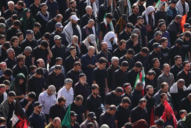 Mourners gather to pray for Iran's slain supreme leader Ayatollah Ali Khamenei during the second day of funeral ceremonies at the Grand Mosalla in Tehran on July 5, 2026. Prayers were held July 5 over the casket of Iran's late supreme leader Ali Khamenei, the second day of funeral ceremonies that have drawn huge crowds to pay their final respects in Tehran. Khamenei ruled the Islamic republic from 1989 until he was killed aged 86 in an airstrike on the first day of the US-Israeli war with Iran on February 28. (Photo by ATTA KENARE / AFP) / 